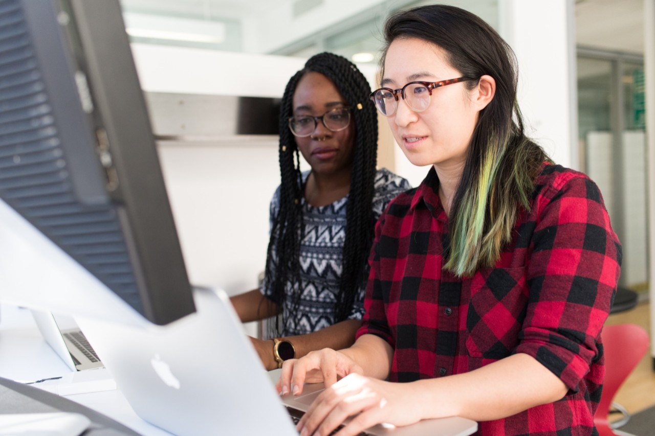 A picture of two students working at a computer