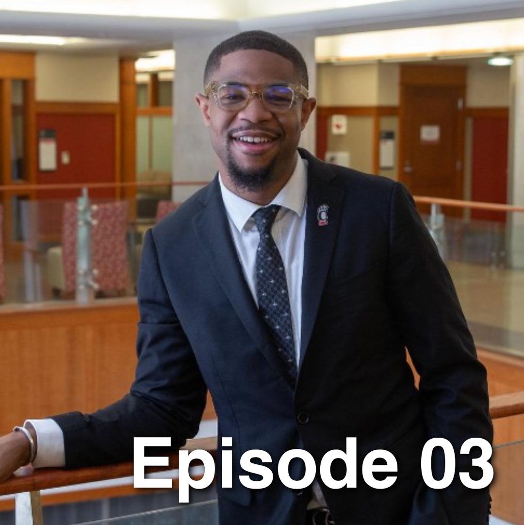 J.Z. Bennett poses in a suit