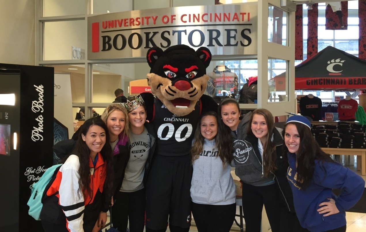 group of females smiling with the Bearcat mascot